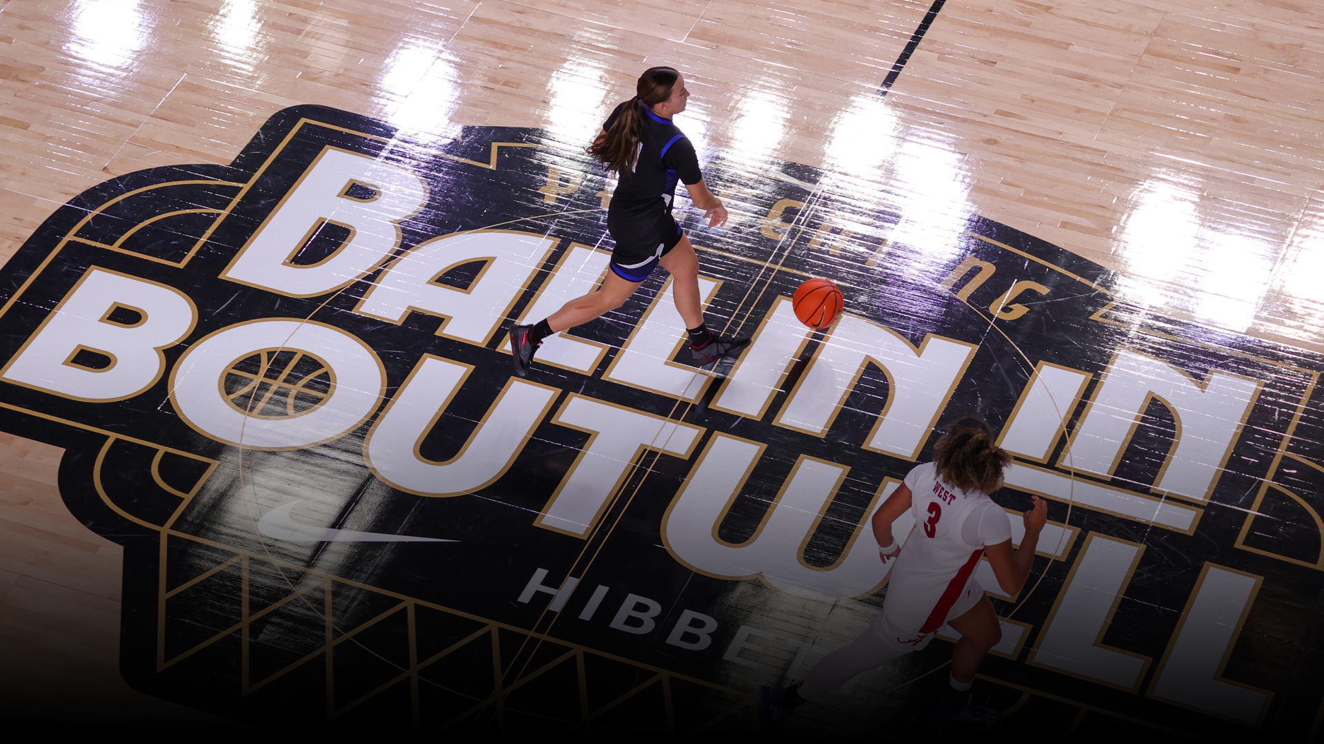 Emily Mouser dribbling on Logo