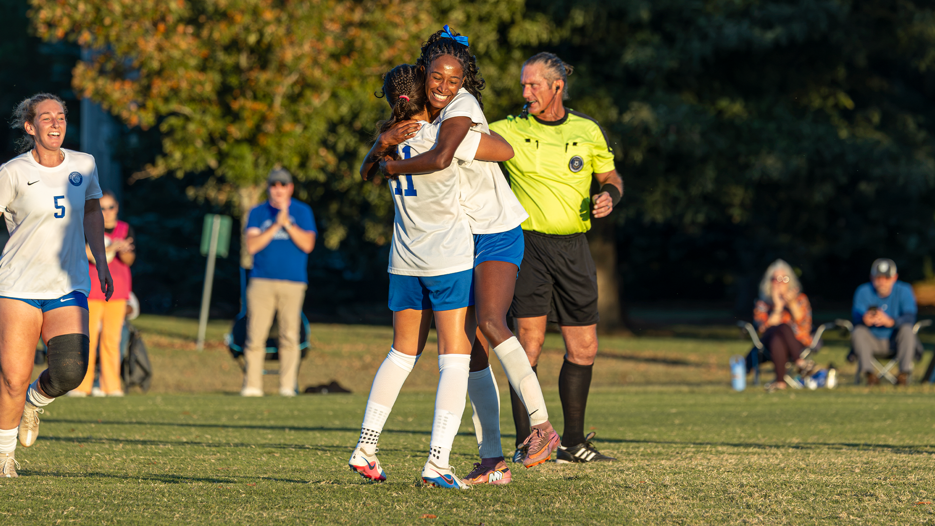 Kaitlyn Lewis and RK Naman celebrate a goal