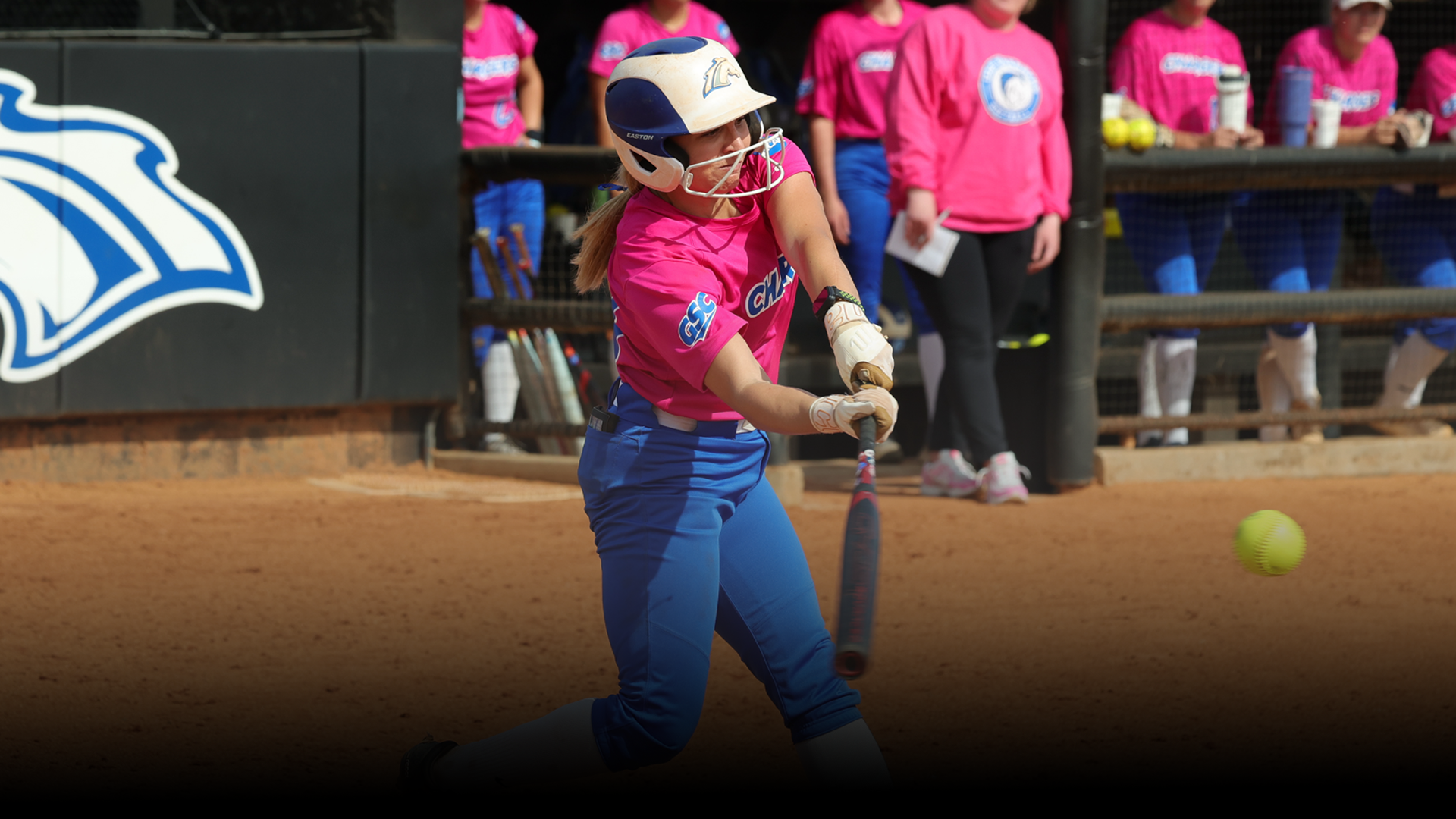 Alexa Douthitt hitting a softball
