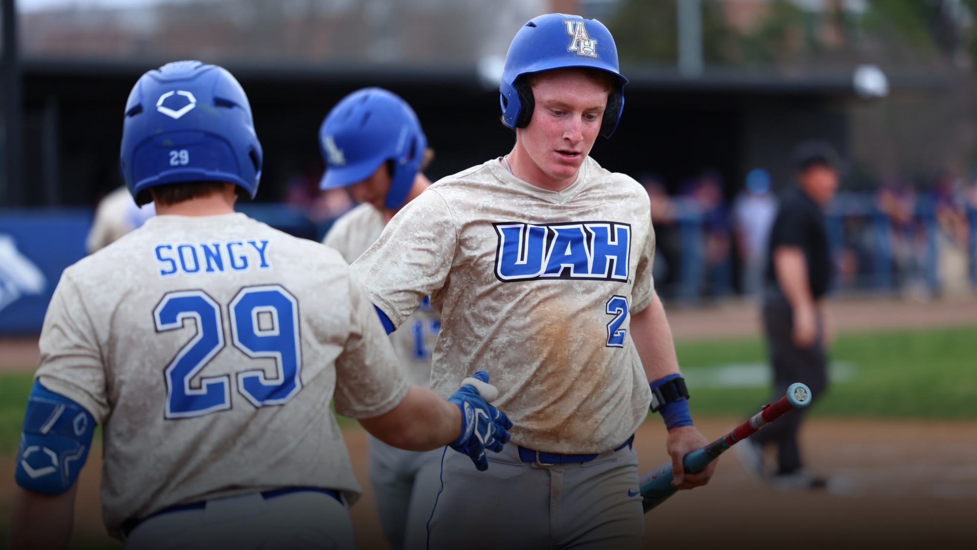 Caleb Mahan high fiving Luke Songy