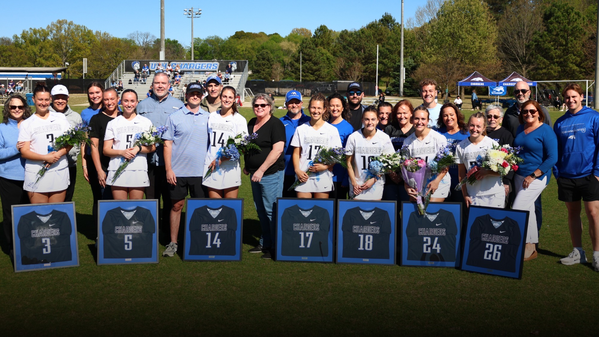 Women's lacrosse seniors with their families pregame