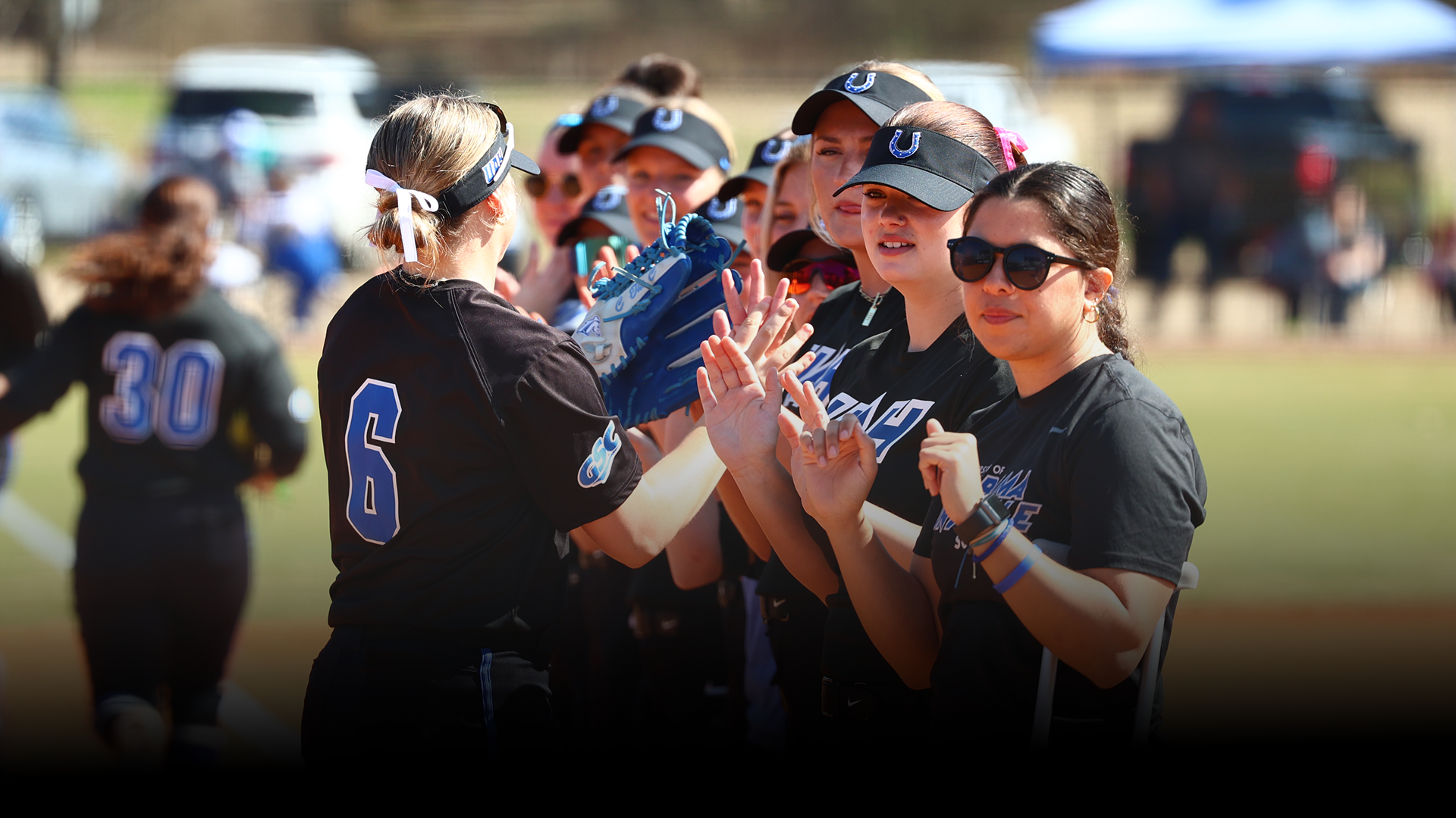 Allie Yeary high-fiving teammates.