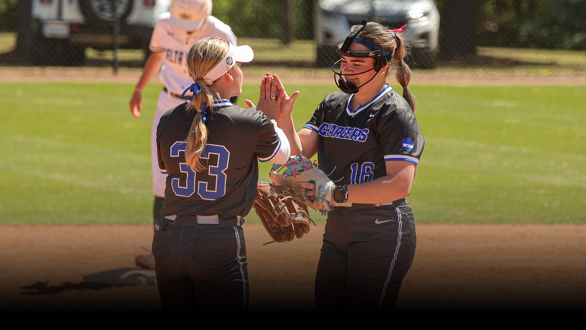 Katie Bracken and Alexa Douthitt high-fiving