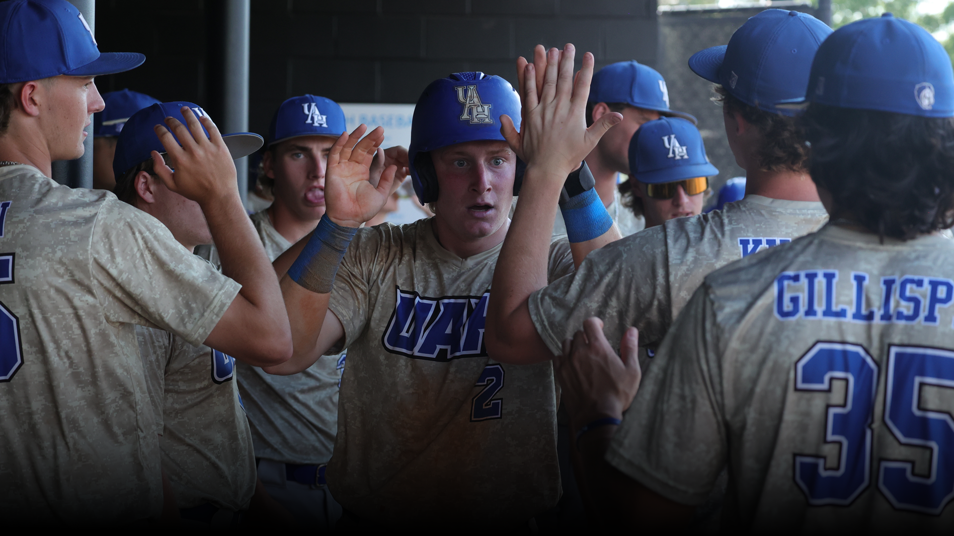 High Fives for Caleb Mahan in the Baseball Dugout