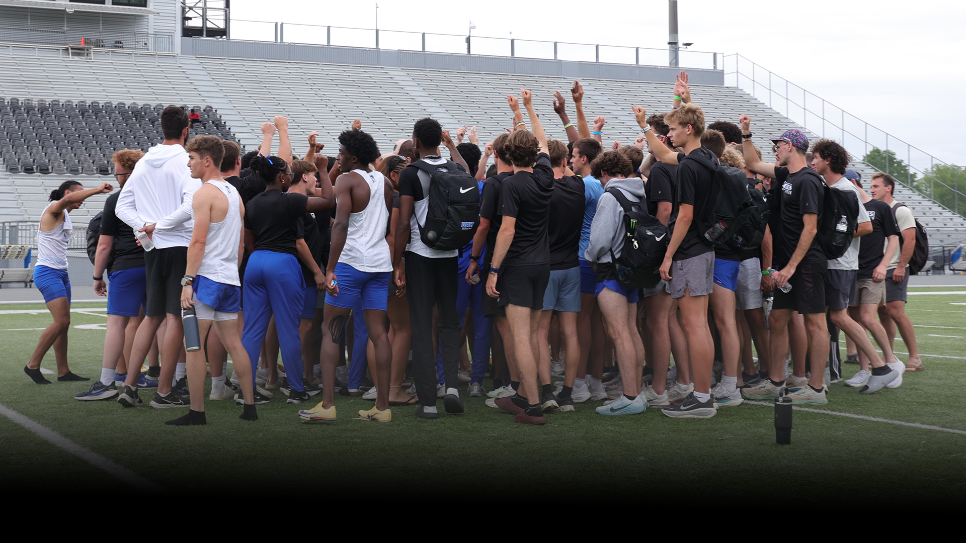 Track & Field Team huddled up after Rocket City Invitational