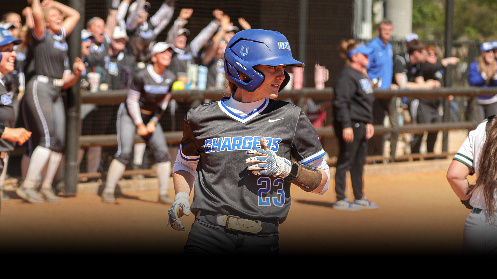 Brittany Slaten smiles as she crosses home plate