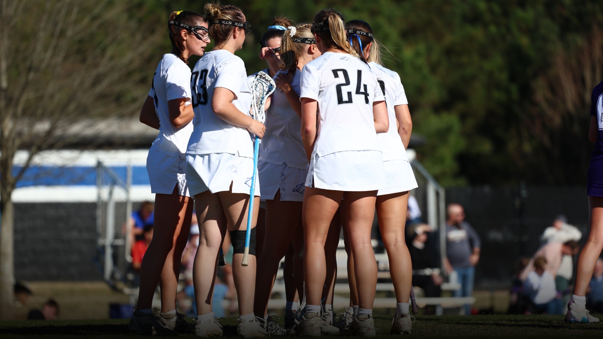 UAH Women's Lacrosse players huddled