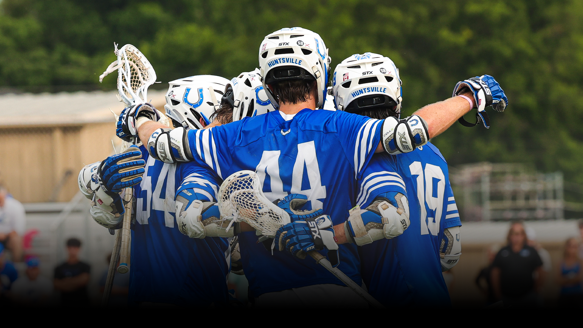 MLAX team celebrating a goal