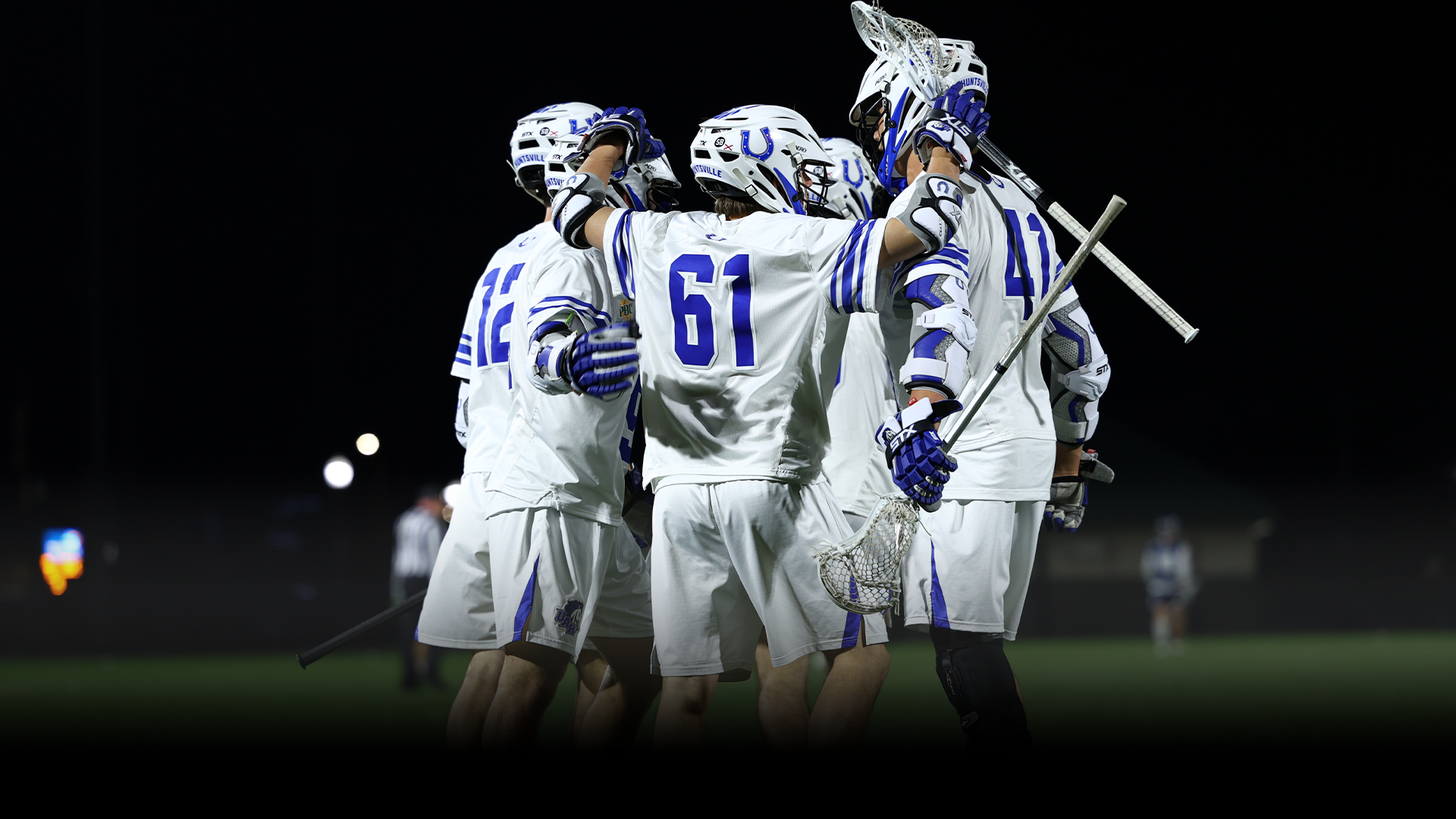 MLAX team celebrates a goal