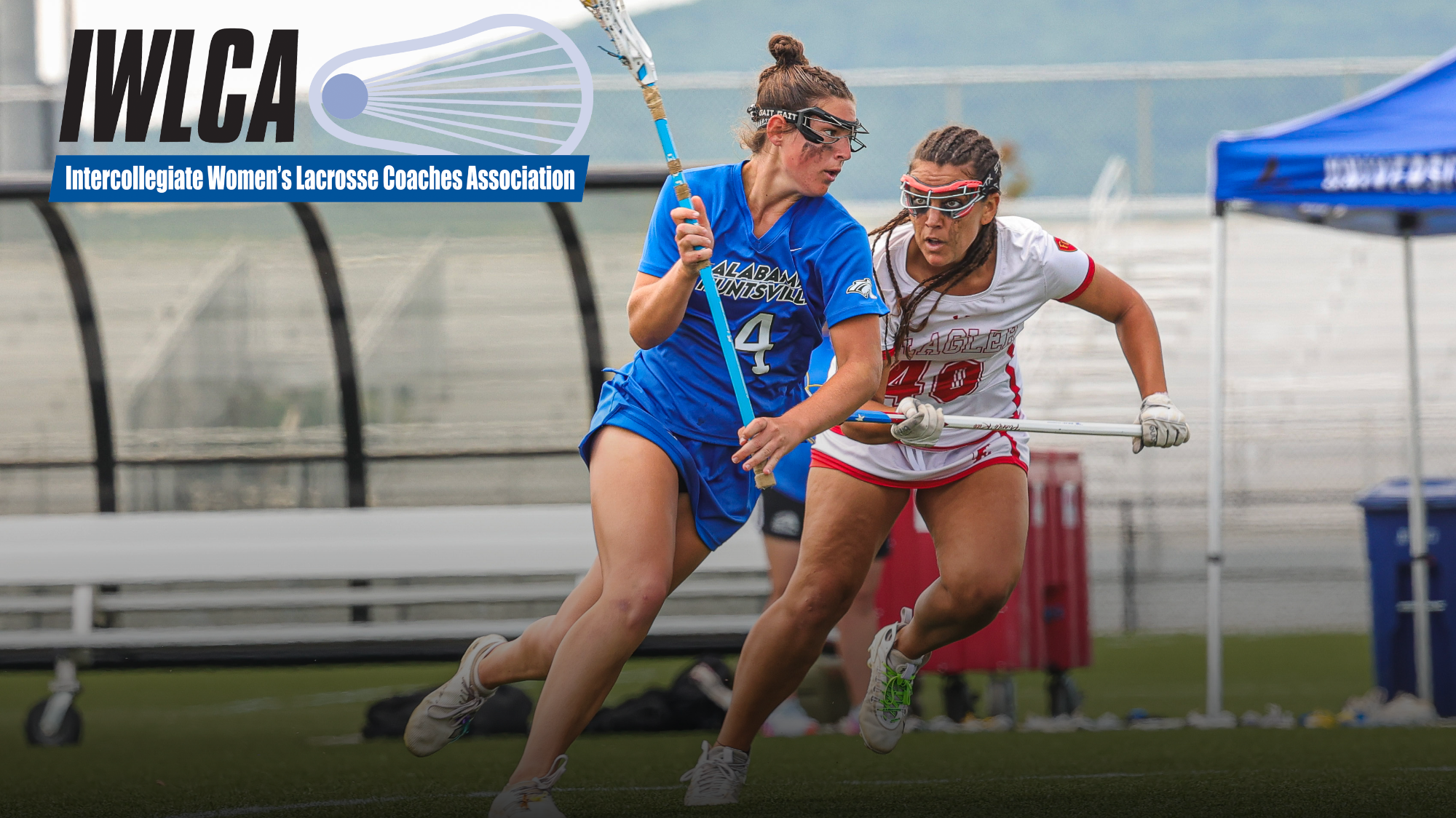 Olivia Rewers carrying lacrosse ball near a defender