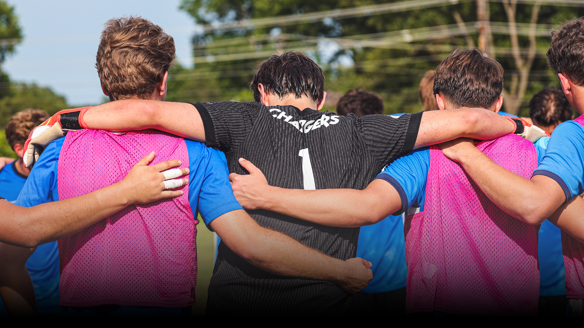 Men's Soccer Team huddled up before a game