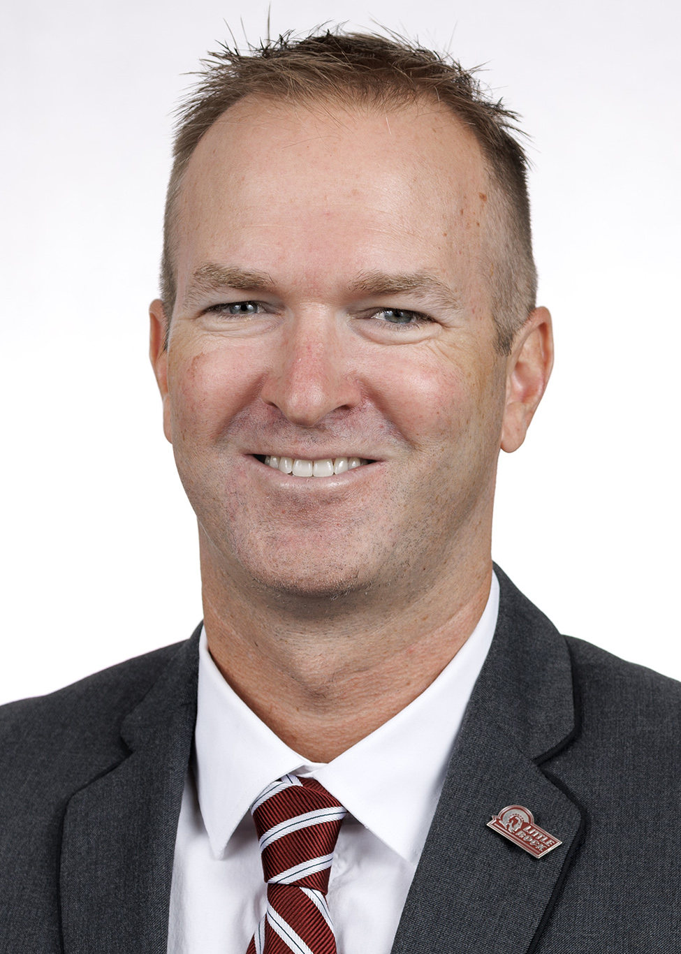 Athletics staff headshot of cross country coach JP Behnke
Photo by Benjamin Krain
