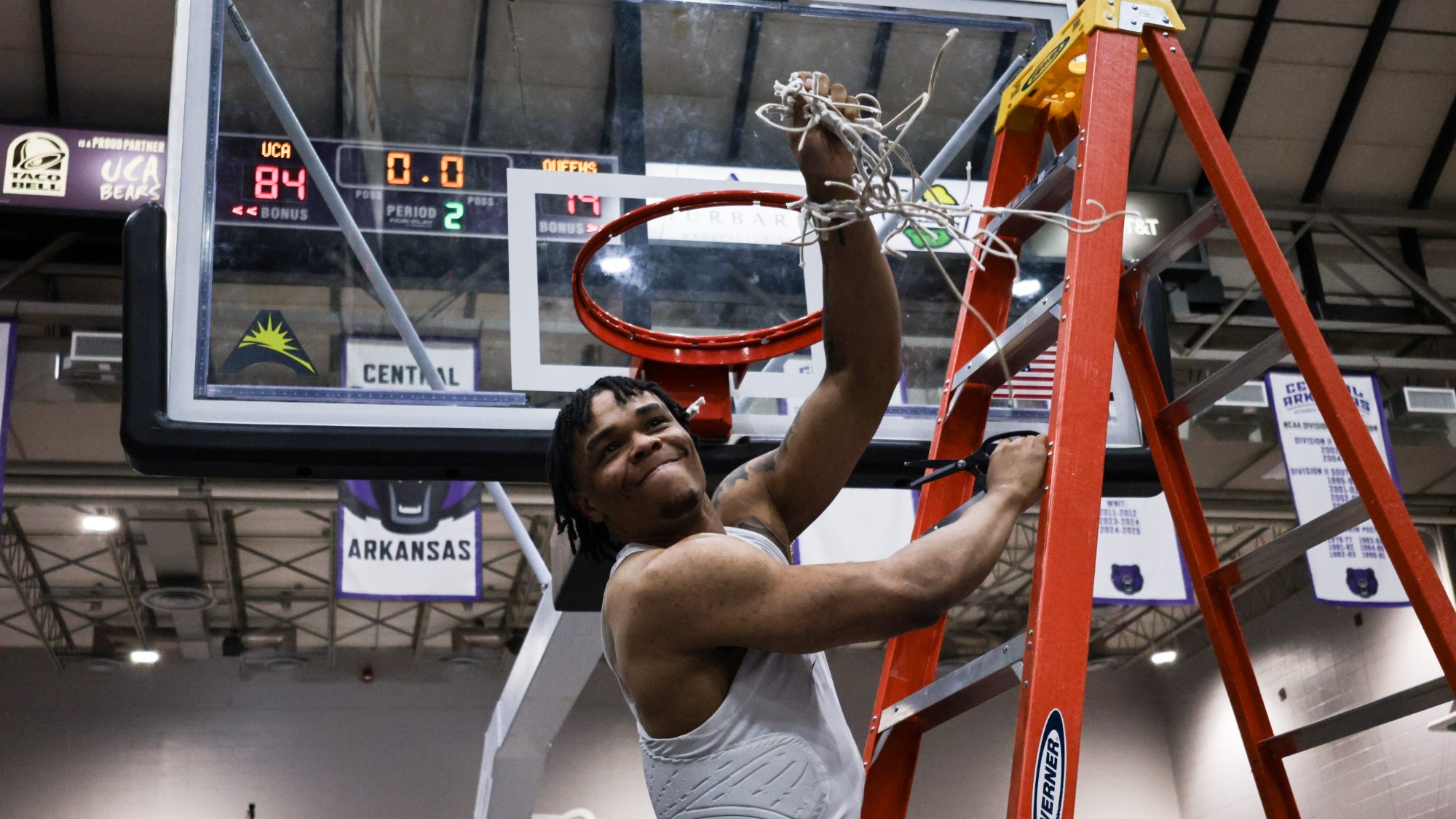 Hunter cutting the net