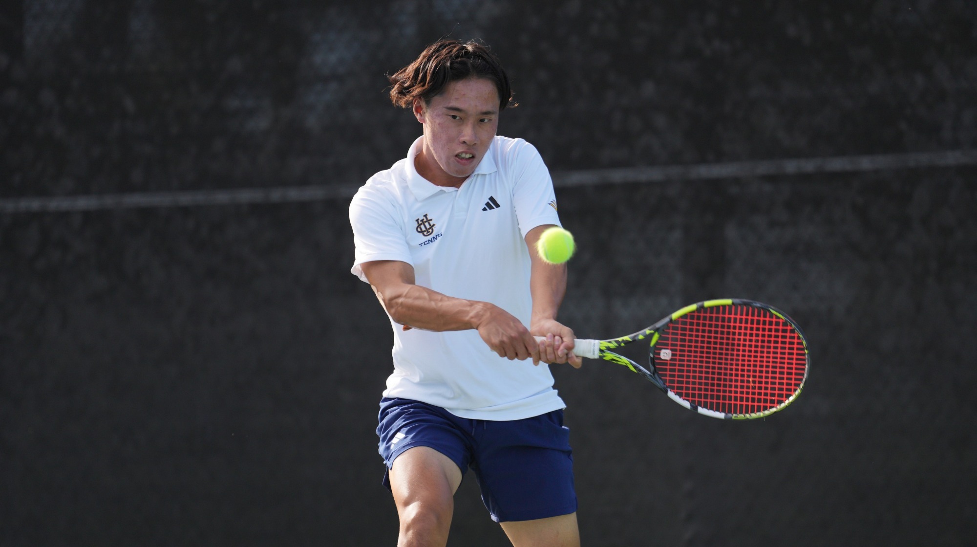 Hiroki Sakagawa hitting a backhand