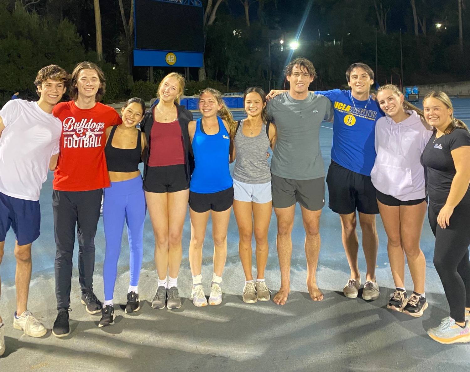 UCLA Club Gymnastics huddles together for a picture after the game.
