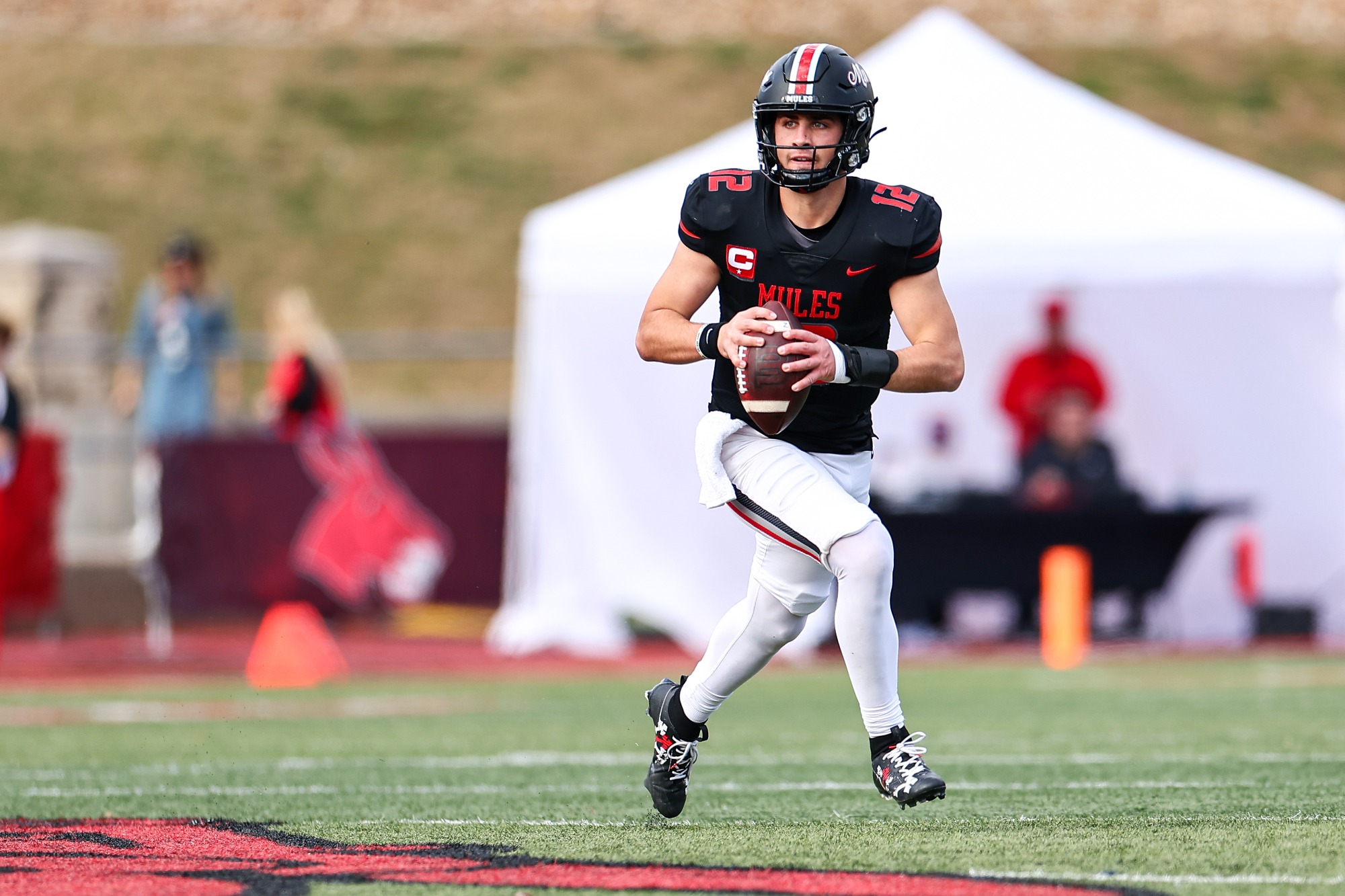 UCM Mules quarterback Zach Zebrowski (12) during an MIAA college football game against the Missouri Southern State University (MSSU) Lions at Walton Stadium/Kennedy Field in Warrensburg, Missouri on November 16, 2024.