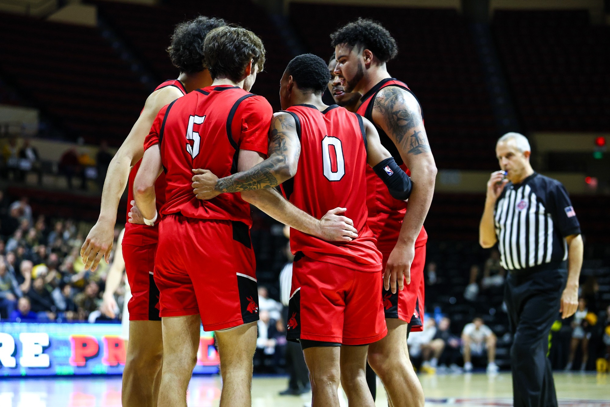 MuleBall team huddle in 2025 MIAA Men's Basketball Championship Quarterfinals vs Fort Hays State