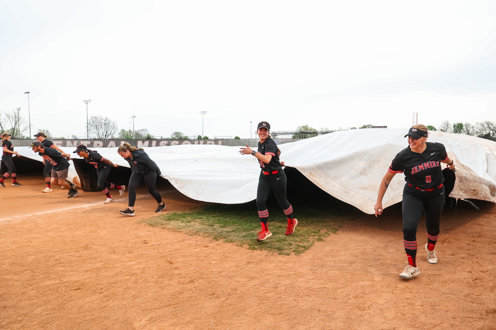UCM Jennies softball team during a MIAA women’s college softball game against the Newman University (NU) Jets on the Jennies Softball Field at the UCM South Recreation Complex in Warrensburg, Missouri on April 18, 2025.