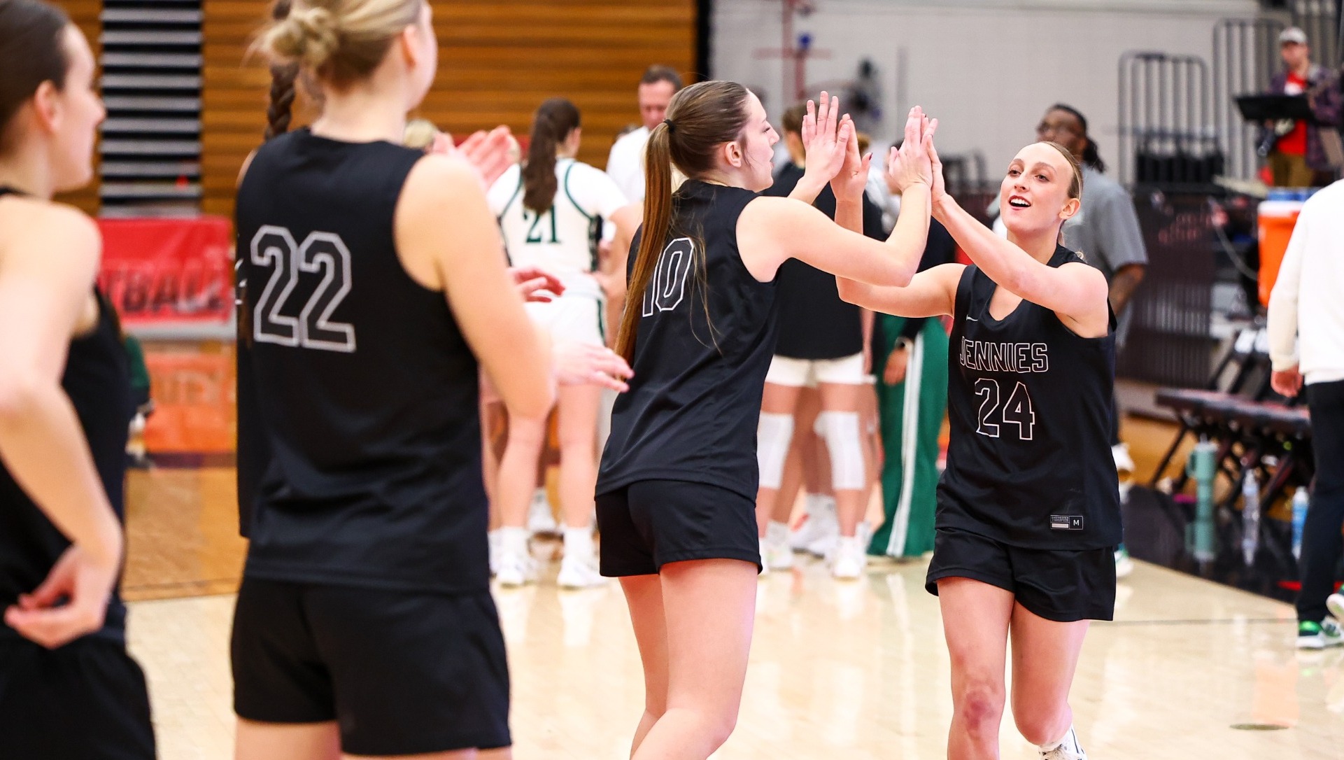 Jennies Basketball high fives vs. Northwest Missouri State