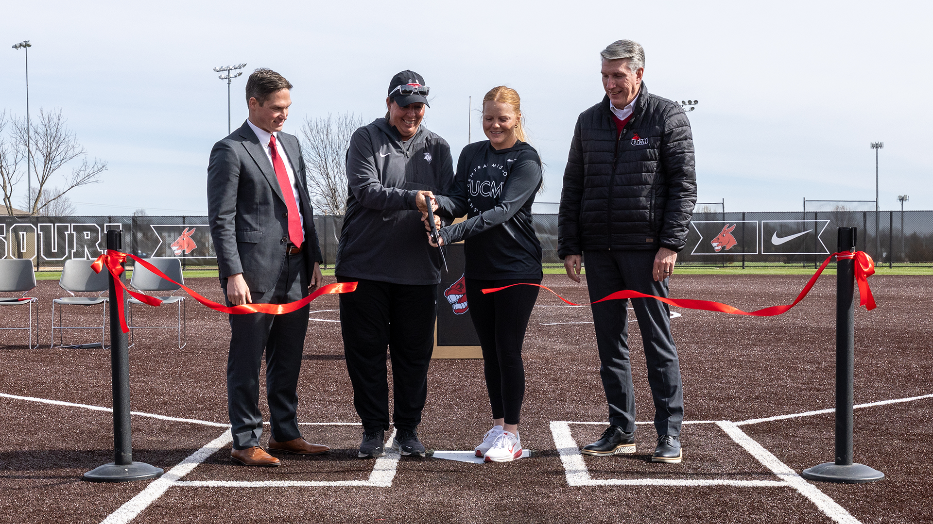 Dr. Roger Best, Matt Howdeshell, Susan Anderson, and Jadyn Sheffield during Jennies Softball Infield Ribbon Cutting Ceremony 