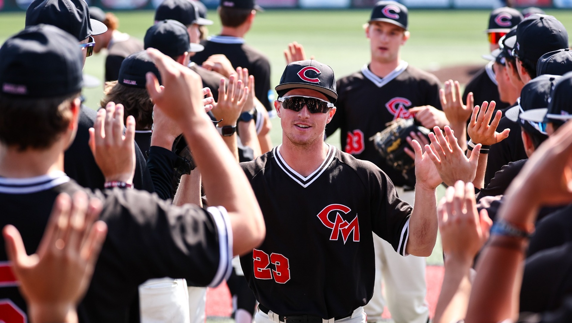 Brock Kobel (23) and Gavin Williams (33) high fives vs. Washburn