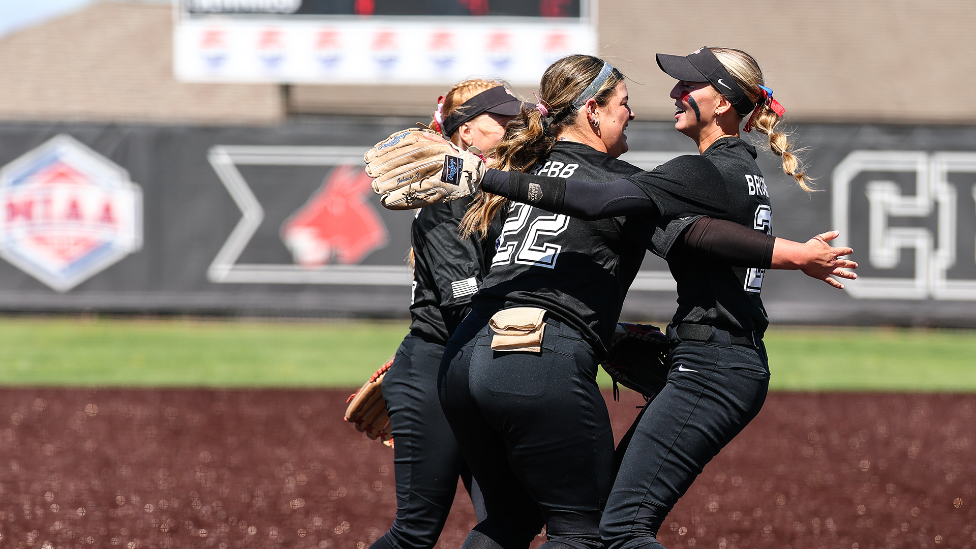 Brumley, Bebb, and Sheffield celebration vs Rogers State