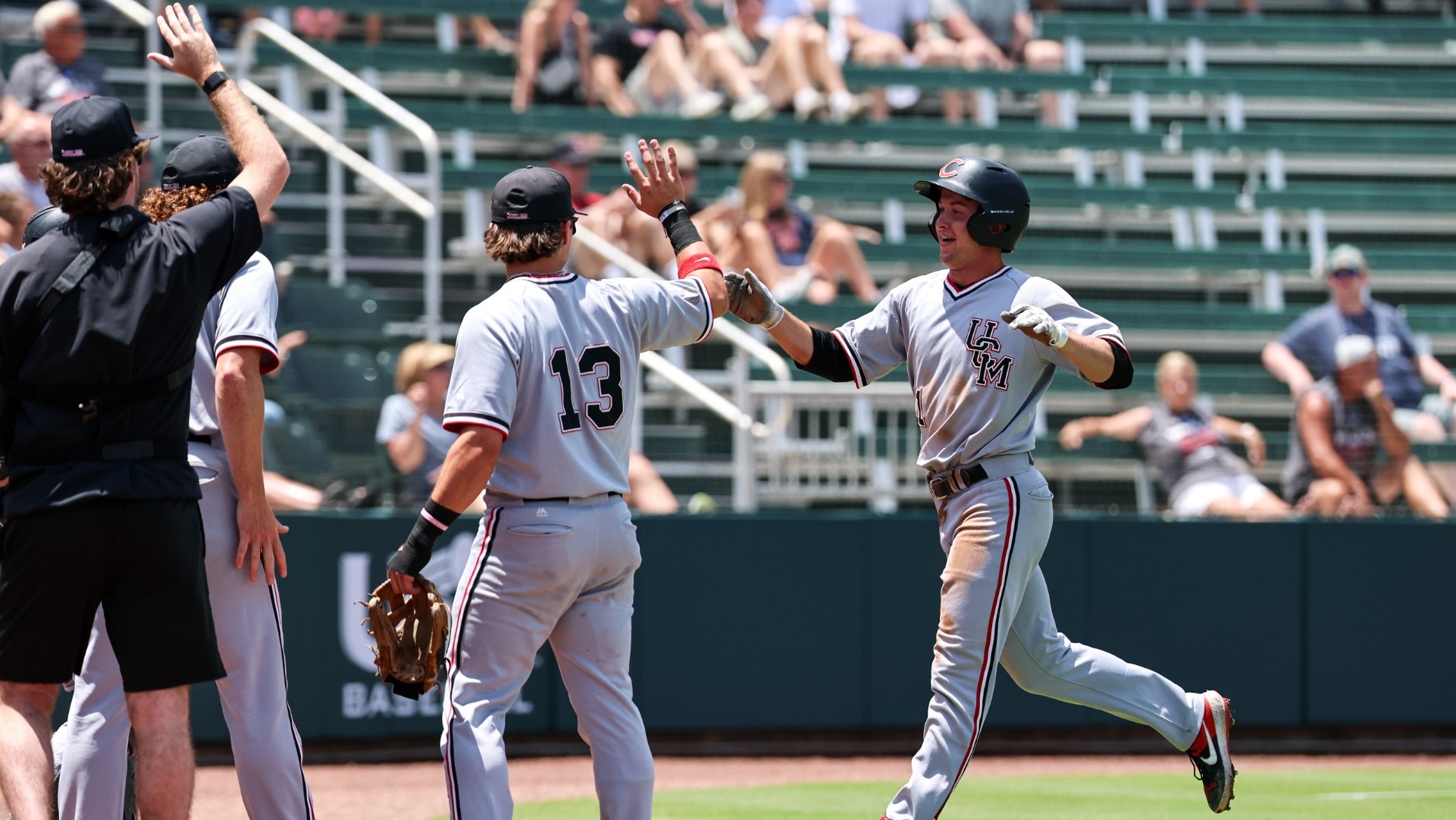 Mules Baseball high fives vs. UIndy in the NCAA-II World Series on Sunday, May 31, 2026 in Cary, North Carolina
