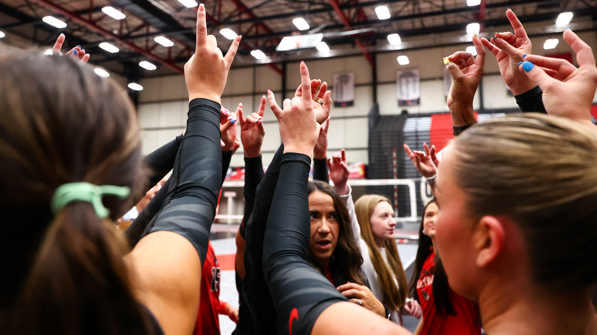 Jennies volleyball group huddle vs Park