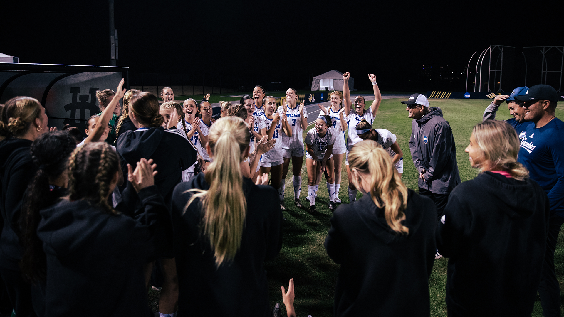 team huddle following win over uci
