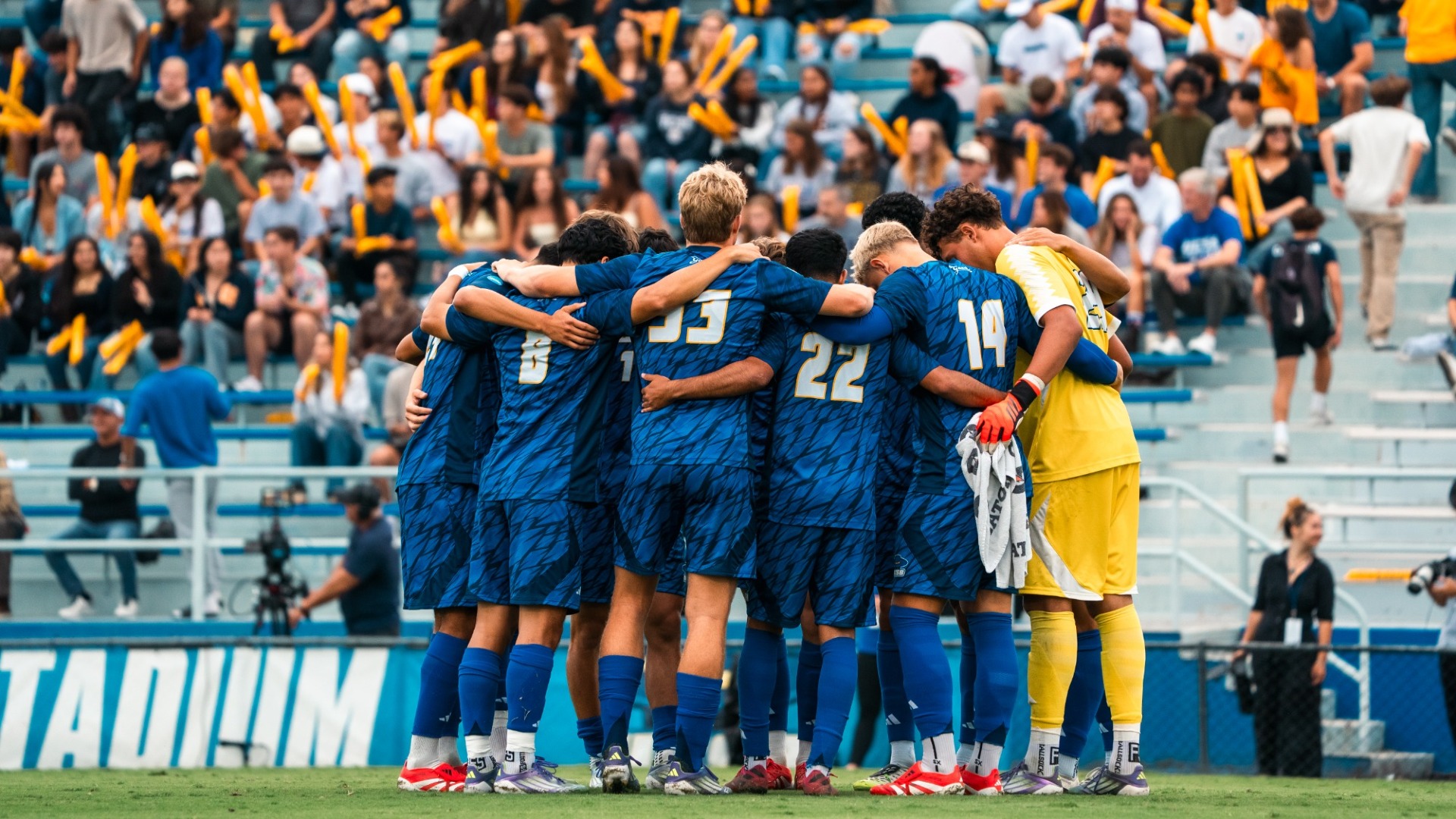Team pregame huddle vs. Cal Poly