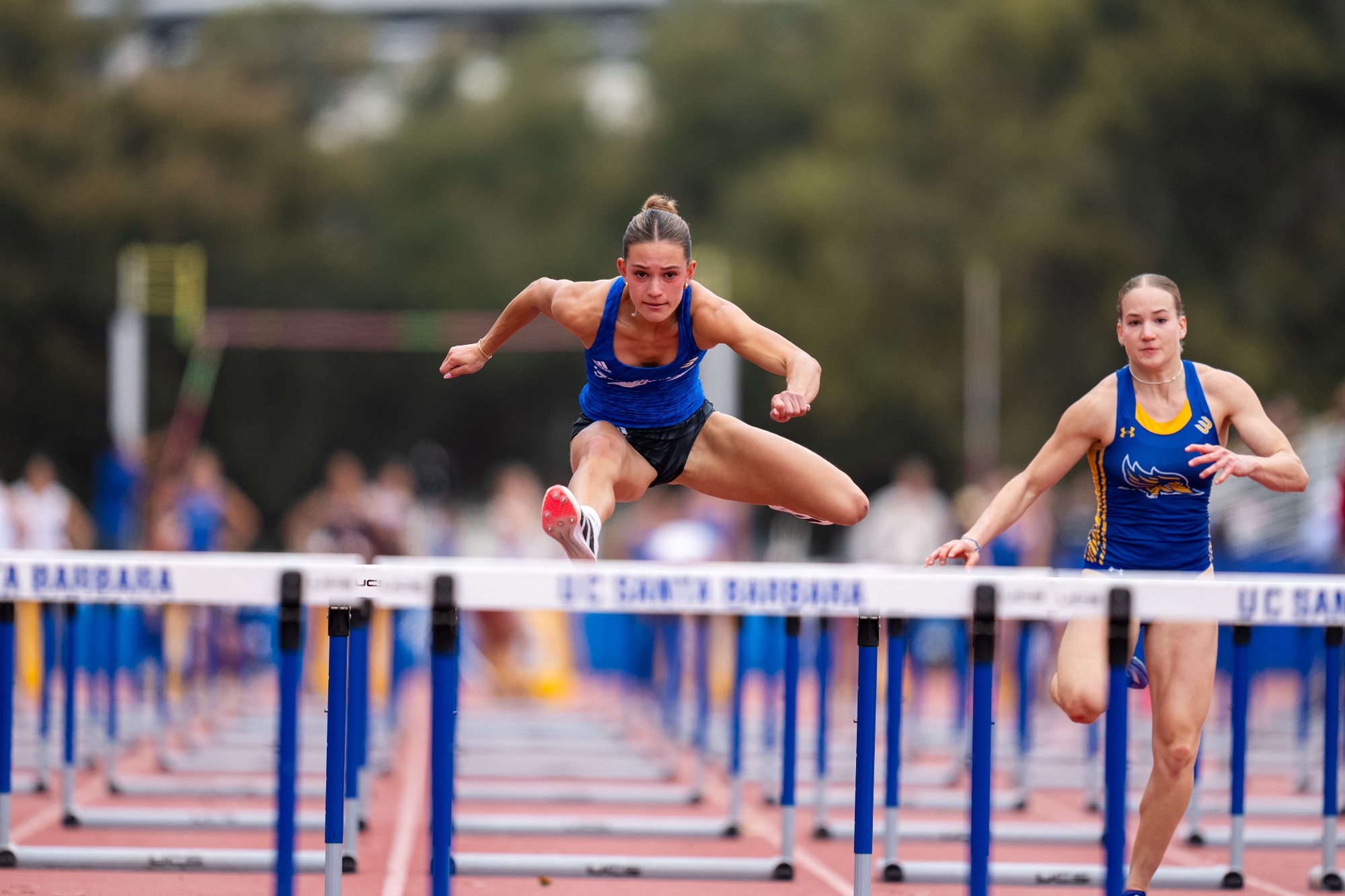 Maddie Conte hurdling