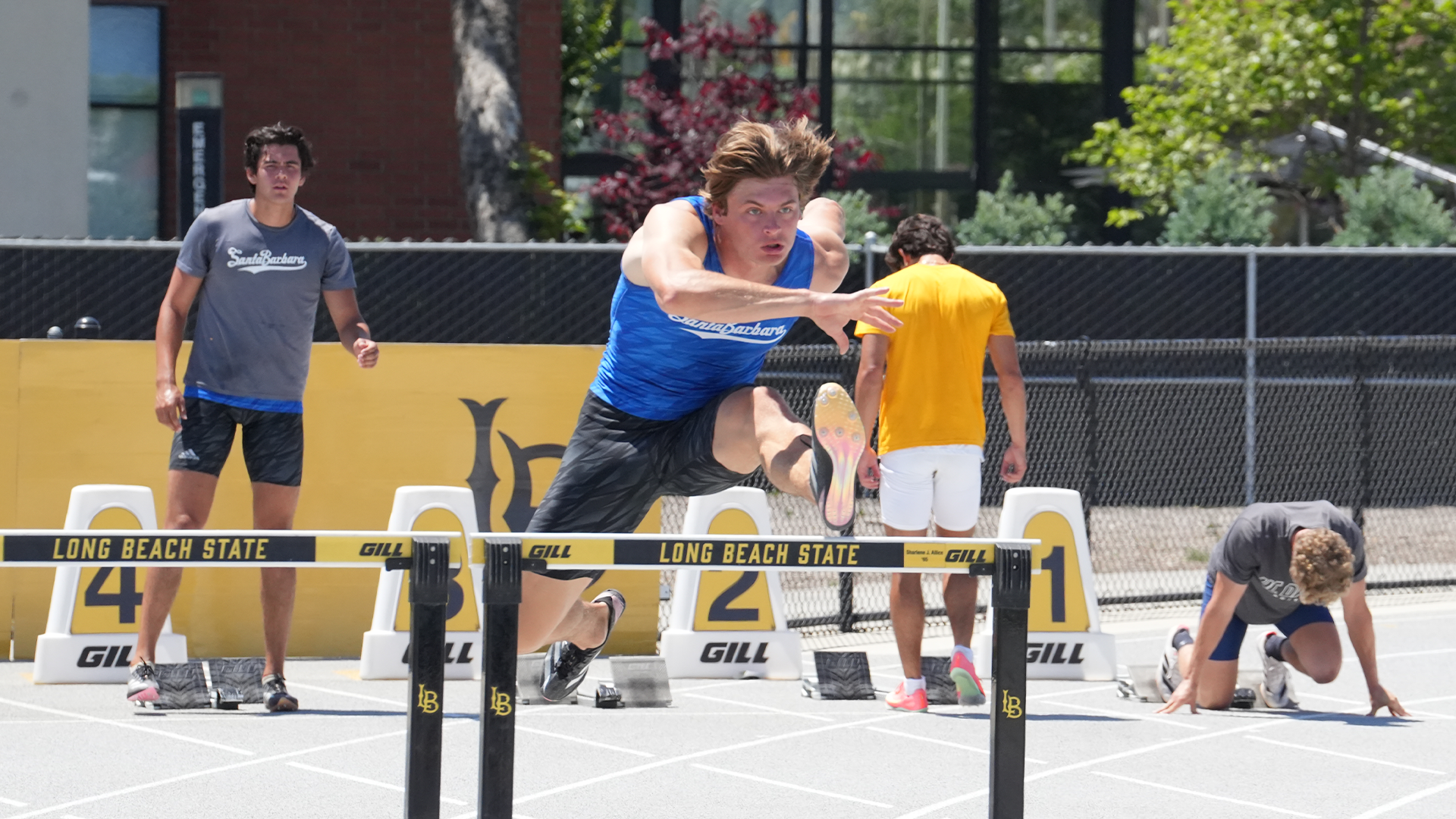 Brad Thomas hurdles at Big West Champions