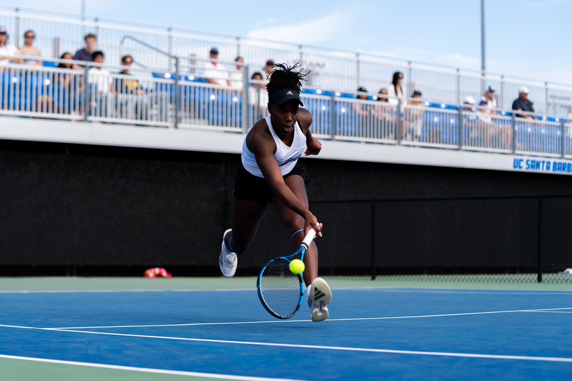 Ekua Youri hustles to the ball