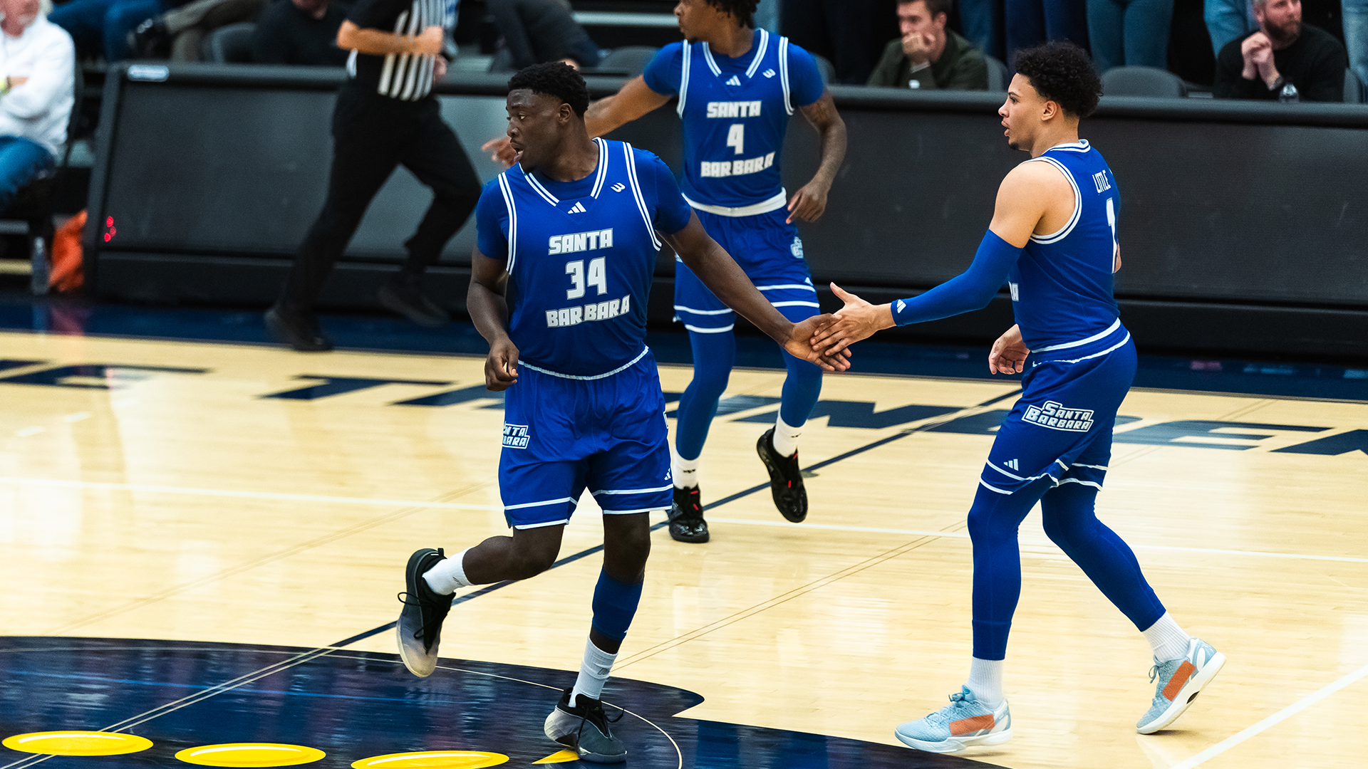 high five miro and hosana after basket vs cal poly