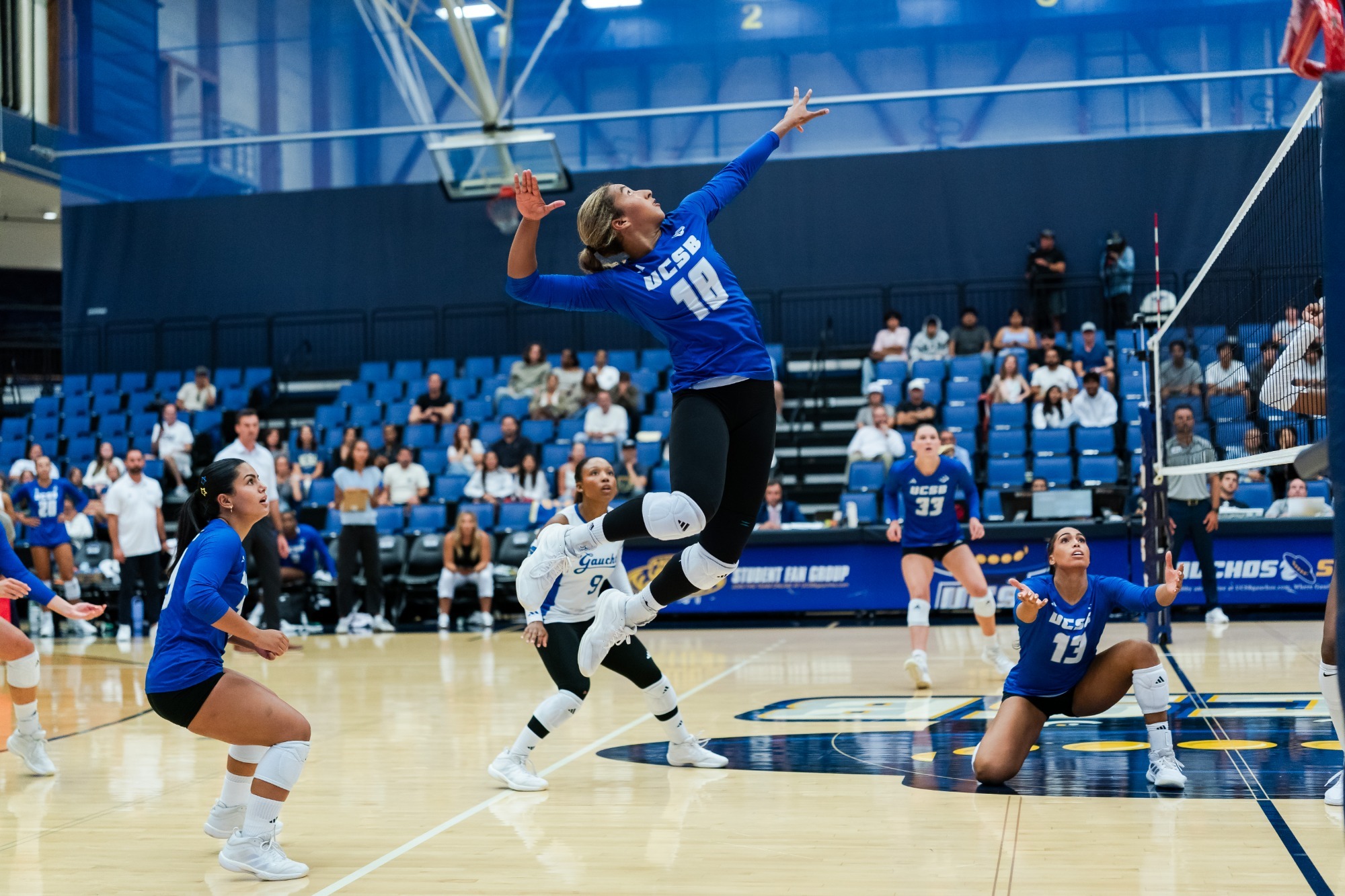 Gabi Martinez leaps to hit the ball 