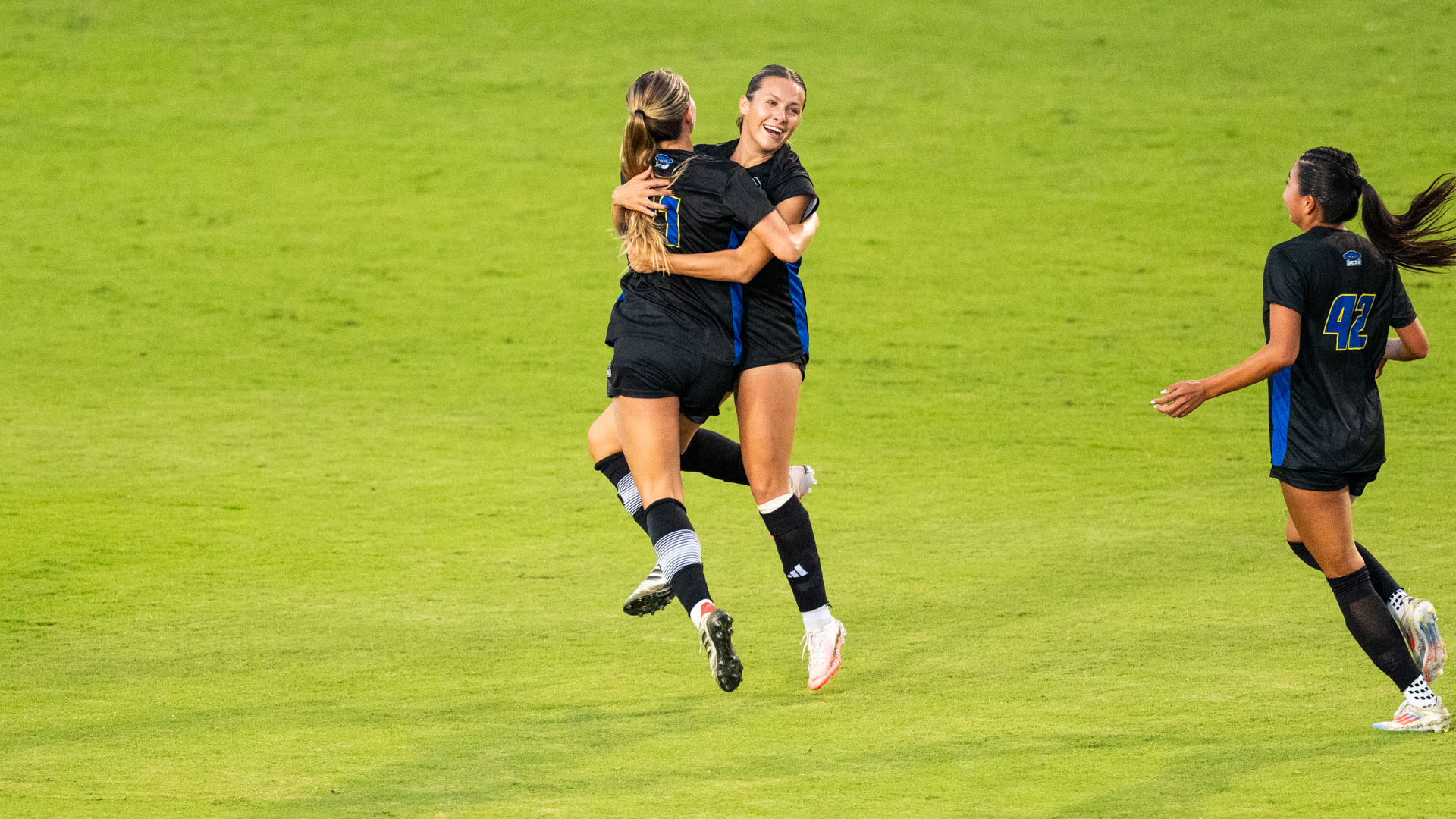 Ava Jarolimek (#18) and Reese Wroblewski (#21) embrace in a hug after Jarolimek's goal against UC Irvine. 