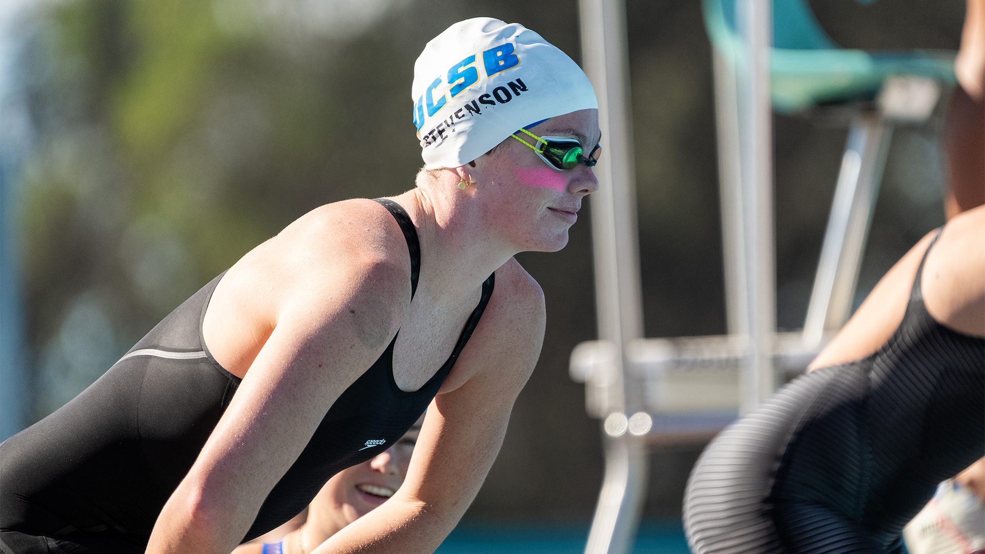 Miranda Stevenson readies for an event by looking out into the pool.