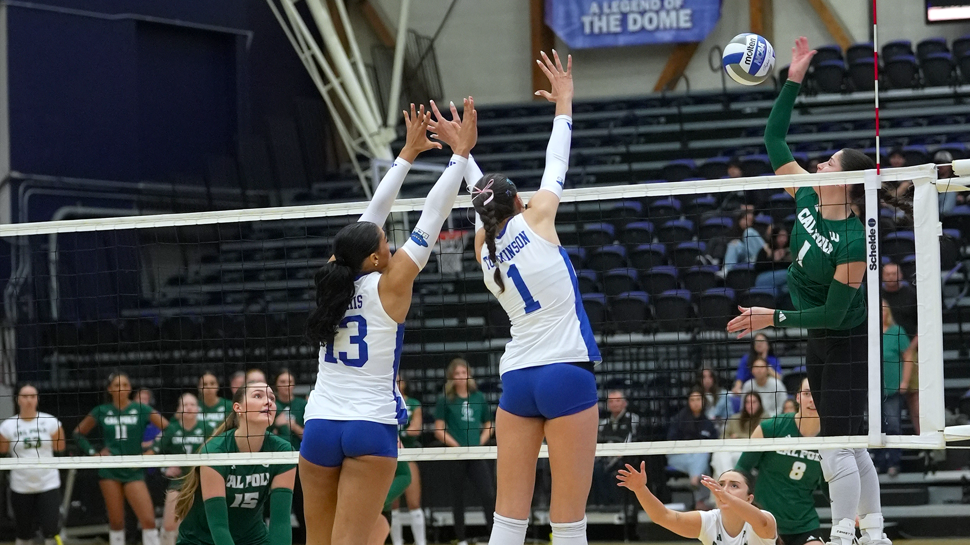 Auburn Tomkinson (#1) and Bella Mathis (#13) but up a block against Cal Poly