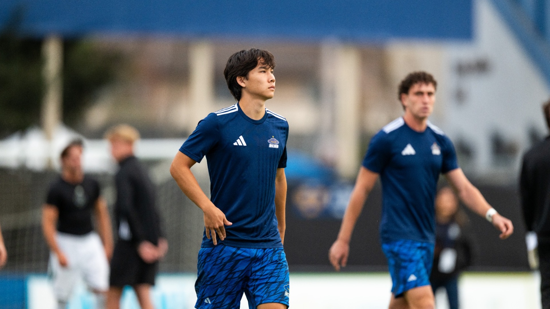 #13 Ethan Senter strolls onto the field at Harder Stadium in his dark blue pre-match warm-up jersey