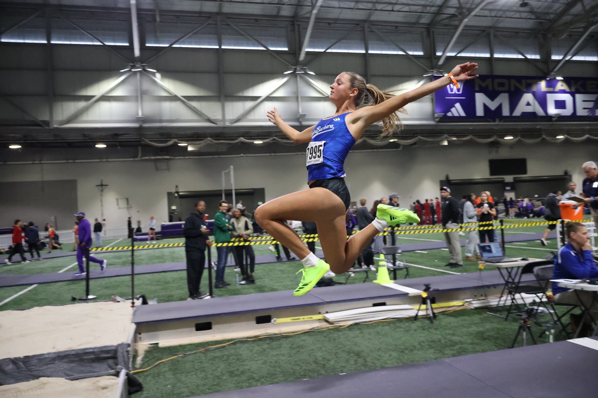 Ally Tito long jumping at UW Invitational