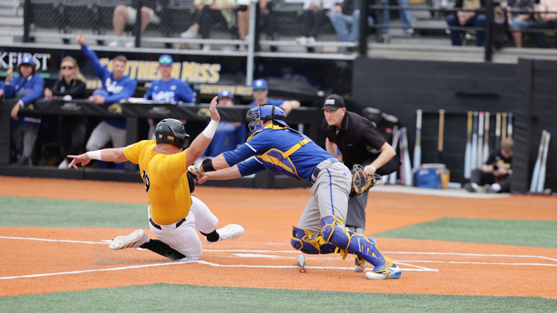Vargas tags a Southern Miss baserunner out at home