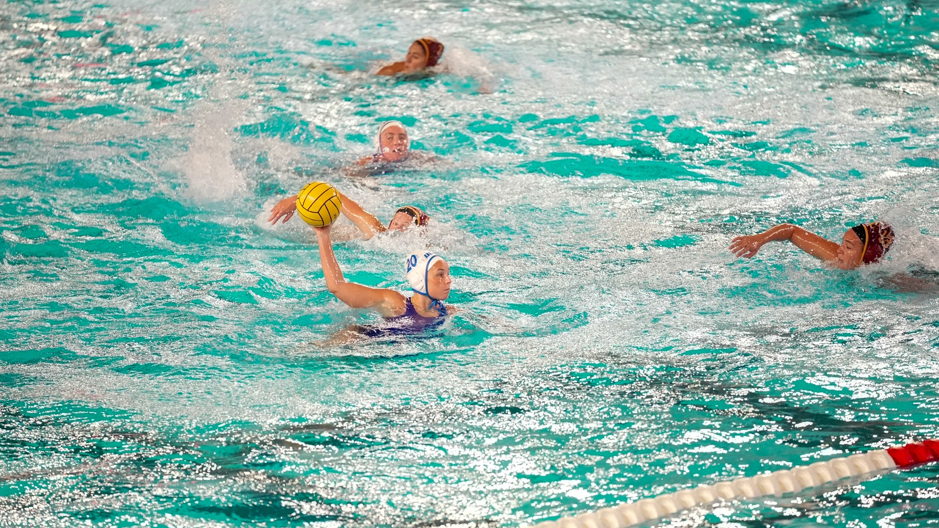 Mia Sullivan swims into space between USC defenders