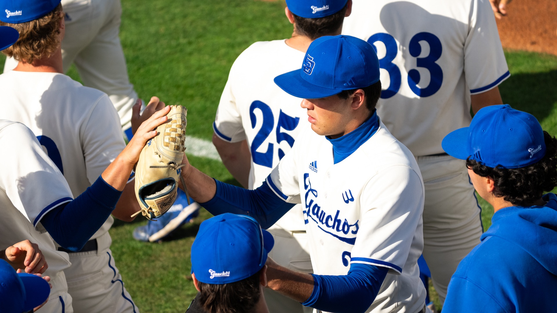 Flora hi-fives teammates returning to dugout