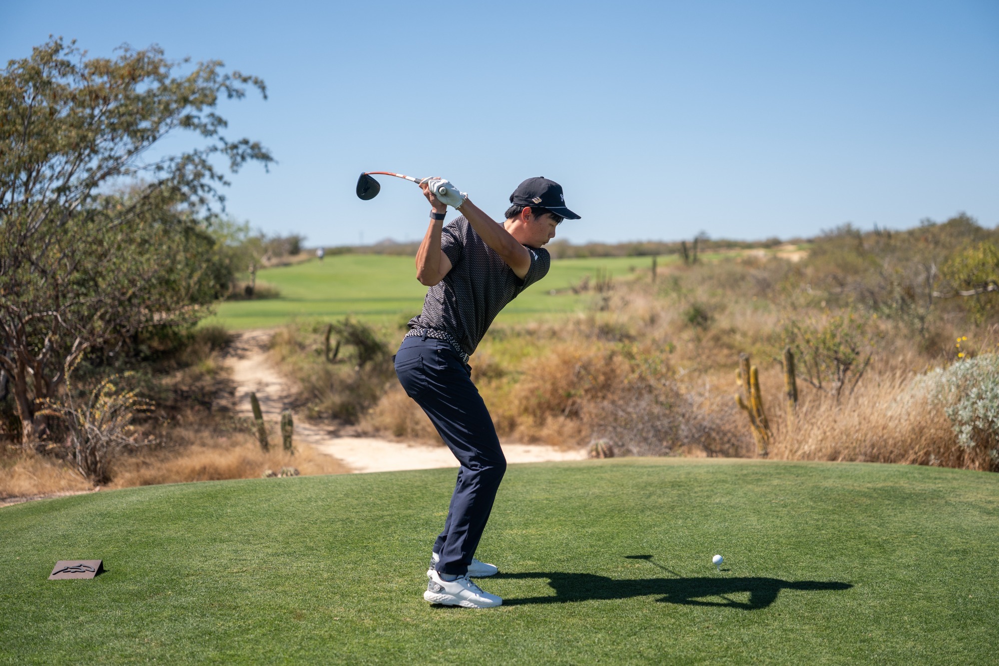 dylan ma at cabo teeing off