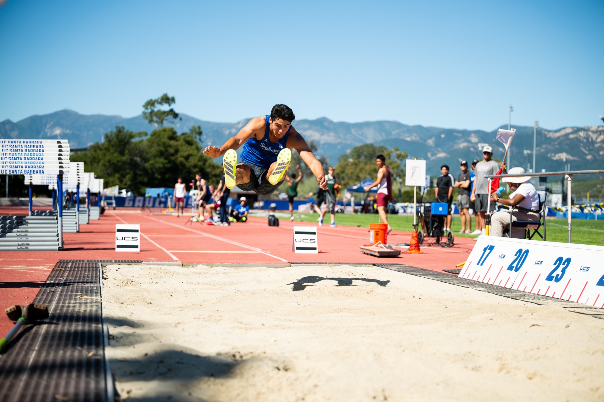 Hudson Shaver in long jump at Gaucho Relays
