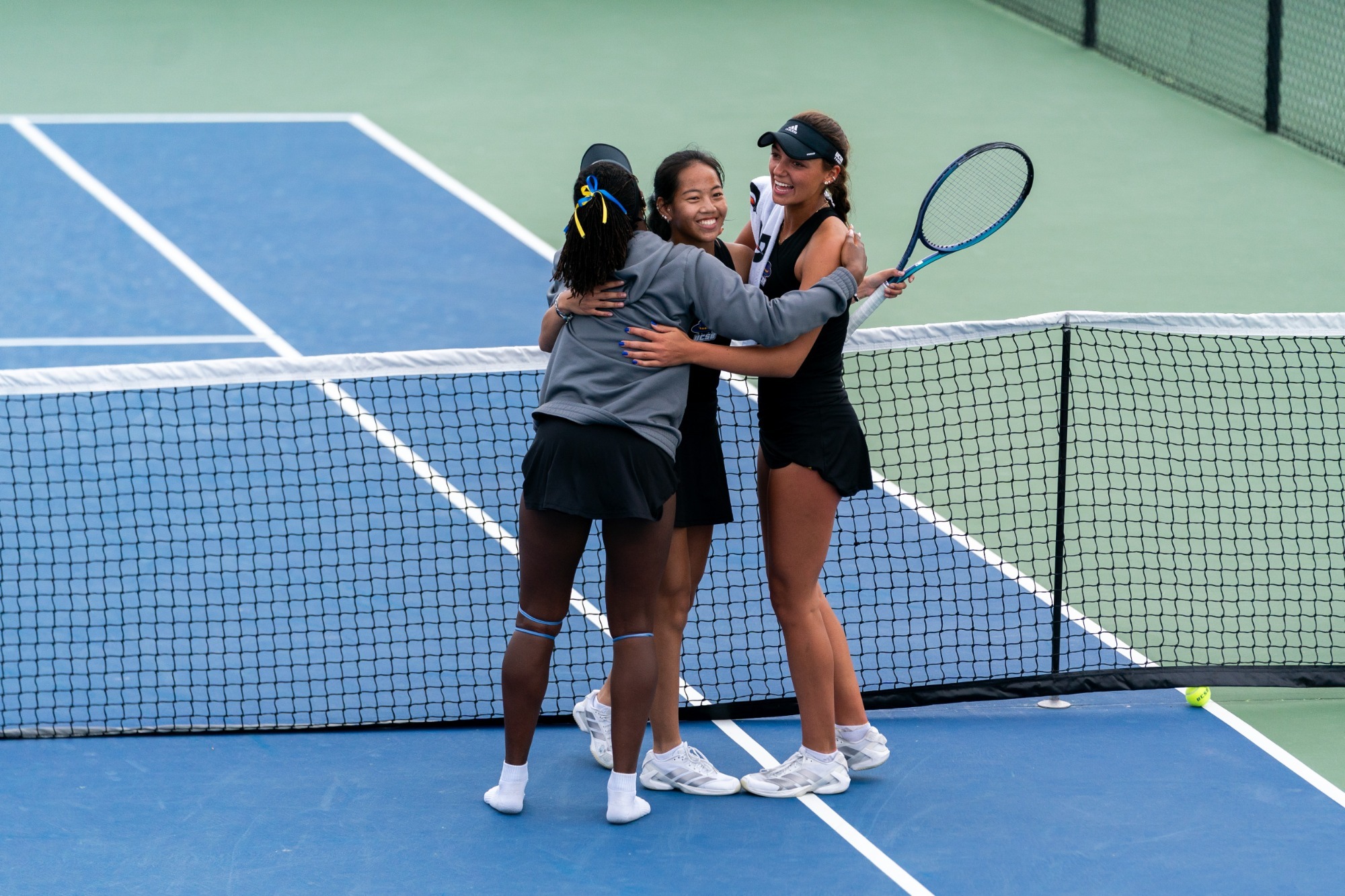 Ekua Youri, Emma Tutoveanu, and Isabella Wong celebrate vs Florida State