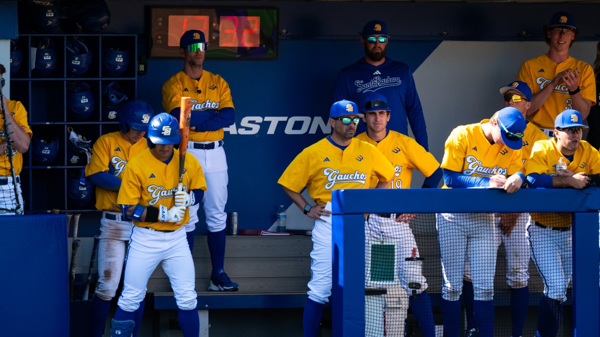 Baseball coaches watch on from the dugout