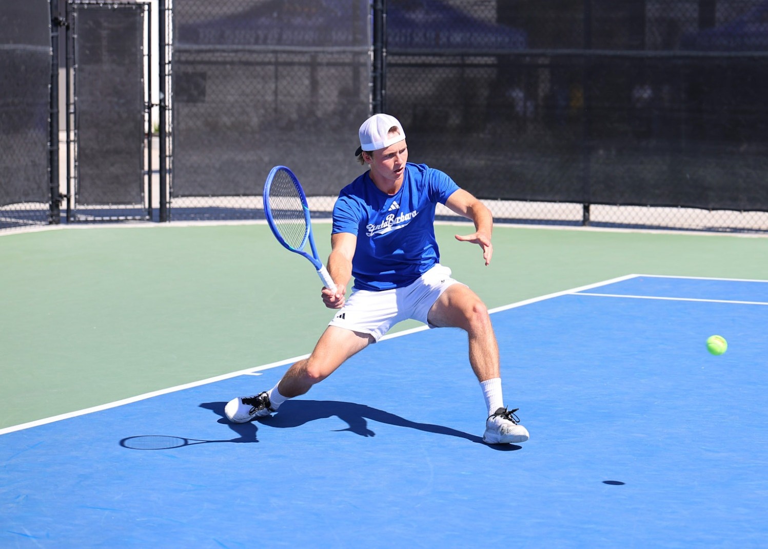 Charlie Underwood goes for a forehand vs Texas Tech