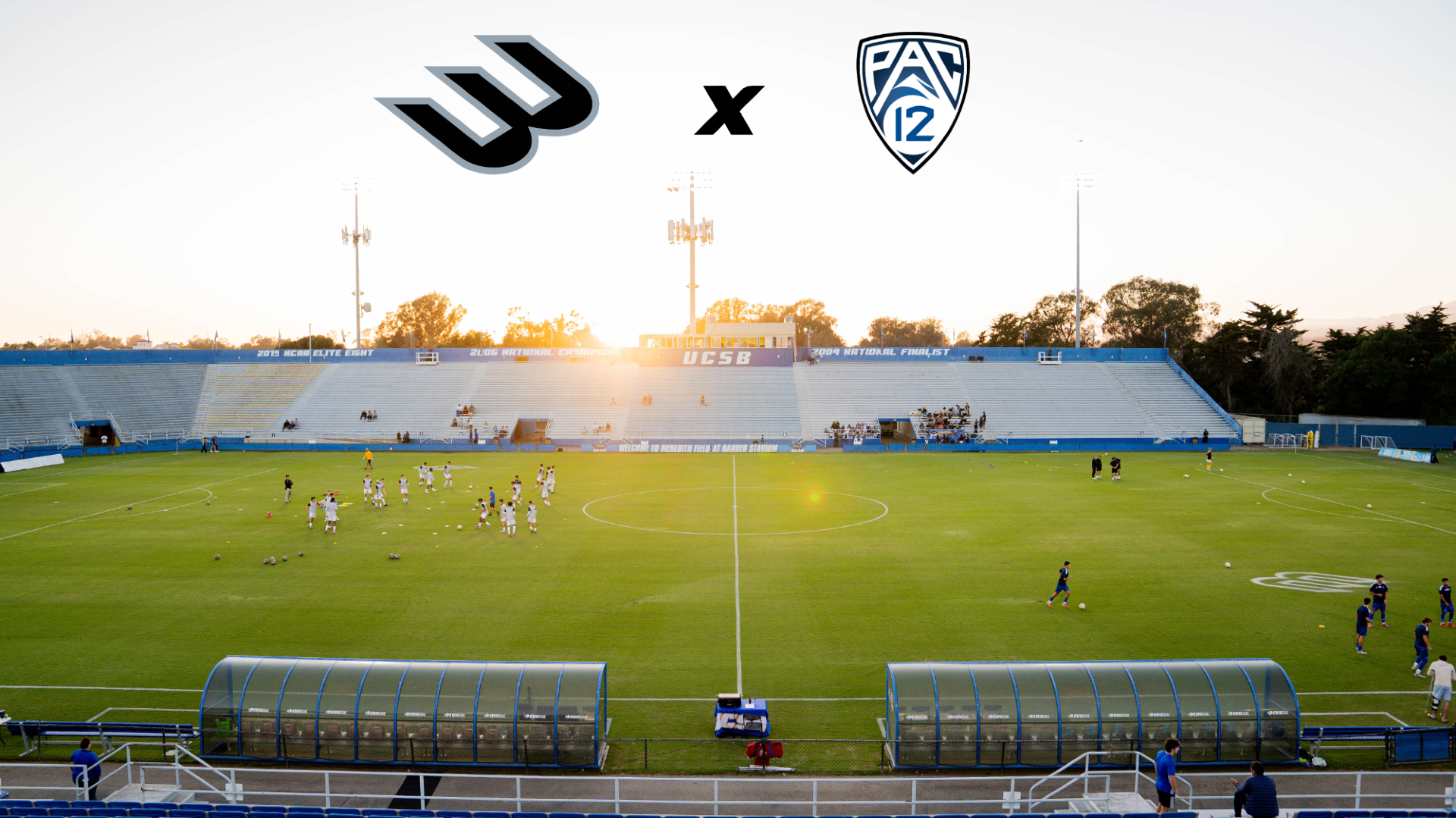 A shot of Harder Stadium at sunset. Our point of view is from the top of the eastern stand, looking down and across the field. As two teams warm up on the field, the sun is just about to dip behind the pressbox and stands on the western side of the stadium. Superimposed in the sky are the logos of The Big West and the Pac-12 Conference, with an X between them.