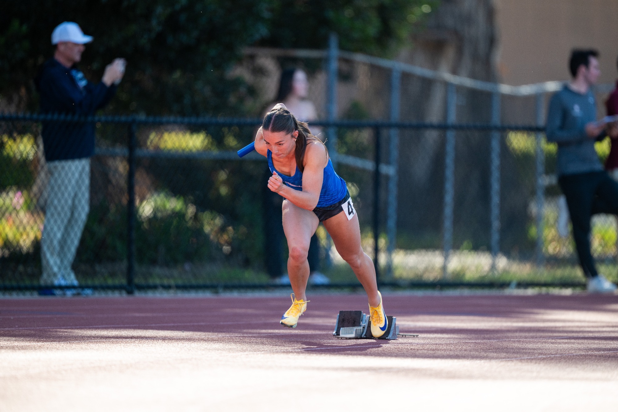 Briana Bartone leading the 4x100m relay